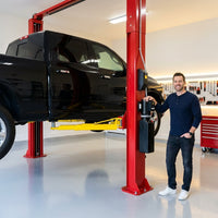 Two Post Car Lift Built for Professional Service, 12000 lb Capacity, 167 Inch Height, Dual Hydraulic System — Lifestyle